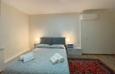 Letto o letti in una camera di Extravaganza Room and Suite Apartment City Center