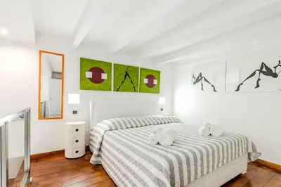 Letto o letti in una camera di Suite Dreams Cagliari Loft