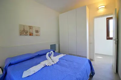 Letto o letti in una camera di Costa Rei Family Beach Apartments 300 m from the Beach