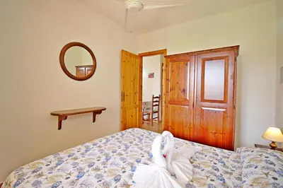 Letto o letti in una camera di Costa Rei Villette Rei Marina con wi-fi
