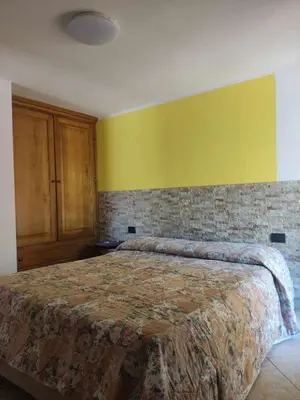 Letto o letti in una camera di Portu Hill Apartments