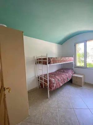 Letto o letti in una camera di Portu Hill Apartments