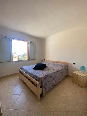 Letto o letti in una camera di Portu Hill Apartments