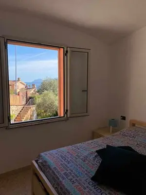 Letto o letti in una camera di Portu Hill Apartments