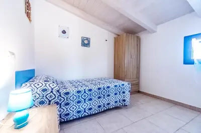 Letto o letti in una camera di Villa Tiziana&Alessia