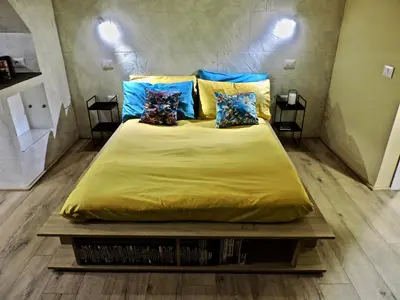Letto o letti in una camera di Collegio Suite