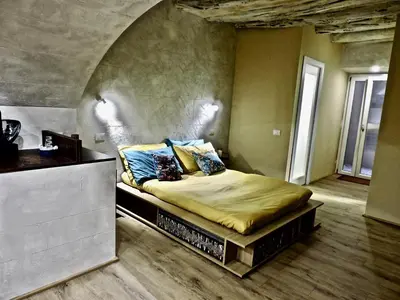 Letto o letti in una camera di Collegio Suite