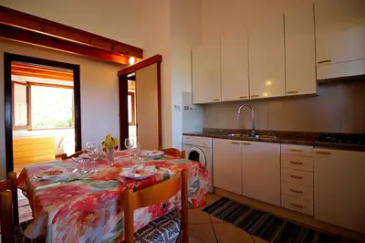 Letto o letti in una camera di Villetta Alba Costa Rei