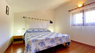 Letto o letti in una camera di Villetta Alba Costa Rei