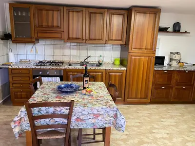 Cucina o angolo cottura di Appartamento con giardino e parcheggio privato Musci