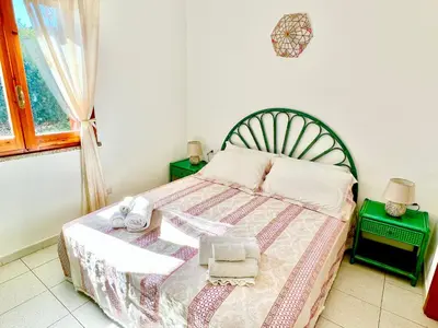 Letto o letti in una camera di Casa Giada Costa Rei