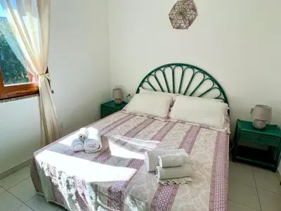 Letto o letti in una camera di Casa Giada Costa Rei