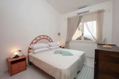 Letto o letti in una camera di Villa Sara