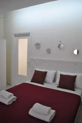 Letto o letti in una camera di Casa del Bottone Room〔Marina〕