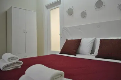 Letto o letti in una camera di Casa del Bottone Room〔Marina〕