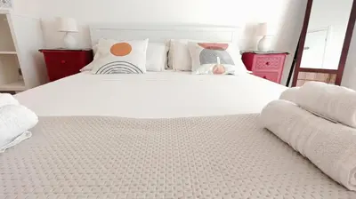 Letto o letti in una camera di KRLY Rooms Cagliari - Parcheggio in centro storico