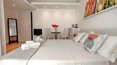 Letto o letti in una camera di KRLY Rooms Cagliari - Parcheggio in centro storico