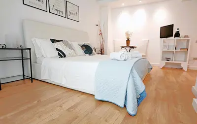 Letto o letti in una camera di KRLY Rooms Cagliari - Parcheggio in centro storico