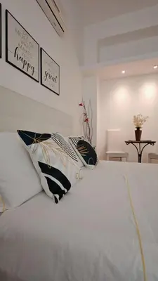 Letto o letti in una camera di KRLY Rooms Cagliari - Parcheggio in centro storico