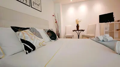 Letto o letti in una camera di KRLY Rooms Cagliari - Parcheggio in centro storico