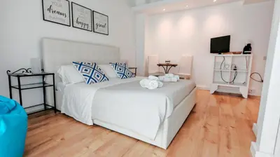 Letto o letti in una camera di KRLY Rooms Cagliari - Parcheggio in centro storico
