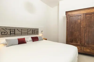 Letto o letti in una camera di Domu Qirat - Authentic Rooms with Private Terraces