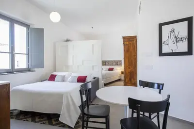 Letto o letti in una camera di Domu Qirat - Authentic Rooms with Private Terraces