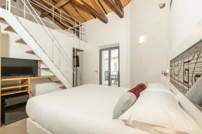 Letto o letti in una camera di Domu Qirat - Authentic Rooms with Private Terraces