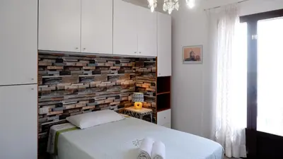Letto o letti in una camera di Affittacamere DOMO AGORA'