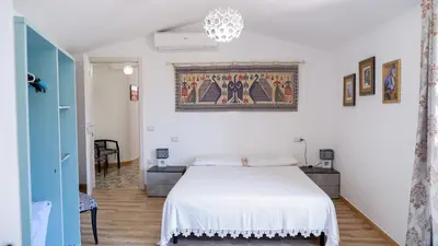 Letto o letti in una camera di Affittacamere DOMO AGORA'
