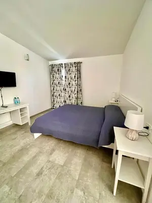 Letto o letti in una camera di Tra Terra e Mare