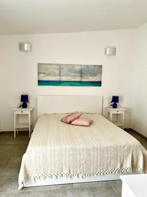 Letto o letti in una camera di Tra Terra e Mare
