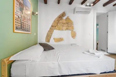 Letto o letti in una camera di Domus Karalis II