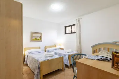 Letto o letti in una camera di Dependance Via Deffenu a 100 metri dalla spiaggia