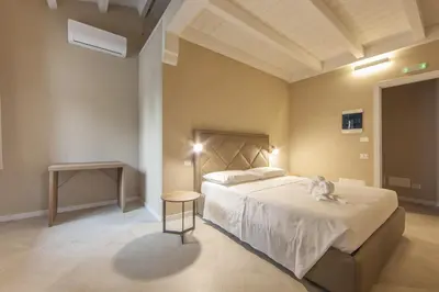 Letto o letti in una camera di Relais Borgo Camisa