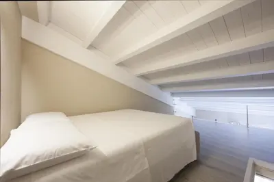 Letto o letti in una camera di Relais Borgo Camisa
