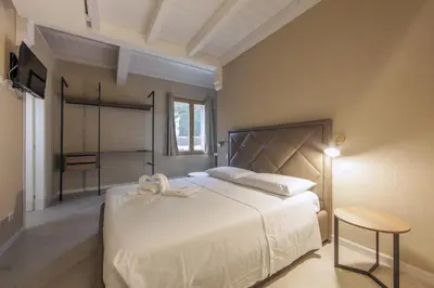Letto o letti in una camera di Relais Borgo Camisa