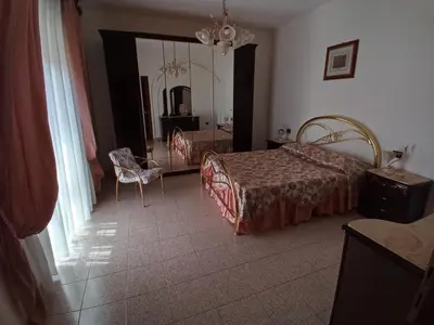 Letto o letti in una camera di B&B L'Asfodelo