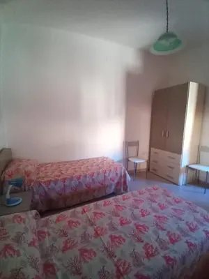 Letto o letti in una camera di B&B L'Asfodelo
