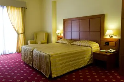 Letto o letti in una camera di Hotel Grillo