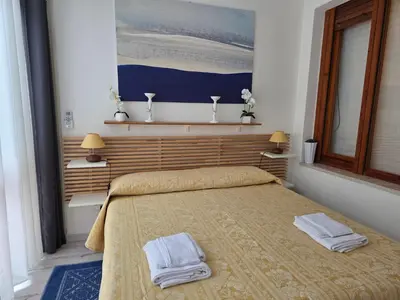 Letto o letti in una camera di Villetta Asfodelo 33 IS Molas