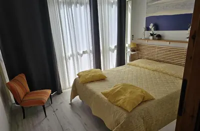Letto o letti in una camera di Villetta Asfodelo 33 IS Molas