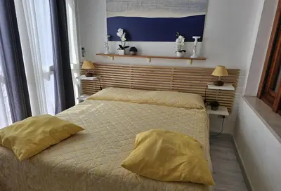 Letto o letti in una camera di Villetta Asfodelo 33 IS Molas