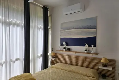 Letto o letti in una camera di Villetta Asfodelo 33 IS Molas