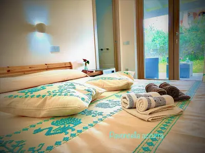 Letto o letti in una camera di B&B Le pavoncelle sarde