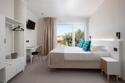 Letto o letti in una camera di MEM Lodge and Suite