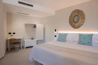 Letto o letti in una camera di MEM Lodge and Suite