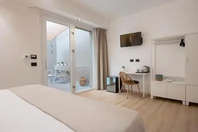 Letto o letti in una camera di MEM Lodge and Suite