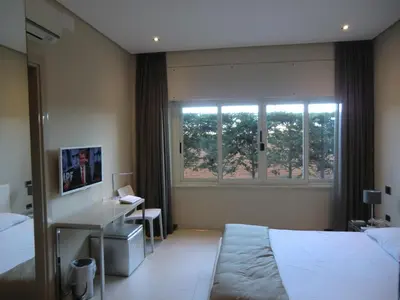 Letto o letti in una camera di B&Beach Cagliari guest house