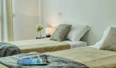 Letto o letti in una camera di IzzHome Everyway